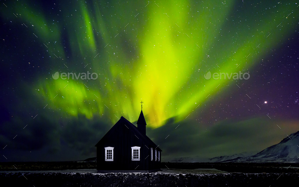 Beautiful Northern light over church - Stock Photo - Images