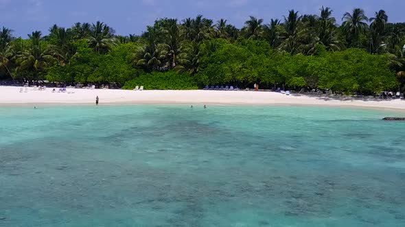 Aerial drone travel of coastline beach by blue sea with sand background alt