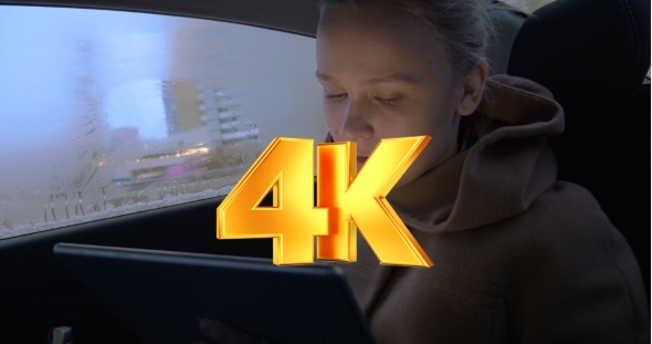 Having Good Time With Pad During Car Travel alt