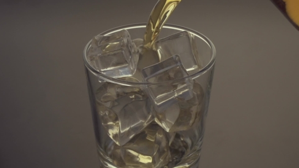 Pouring a Scotch Whiskey On The Rocks