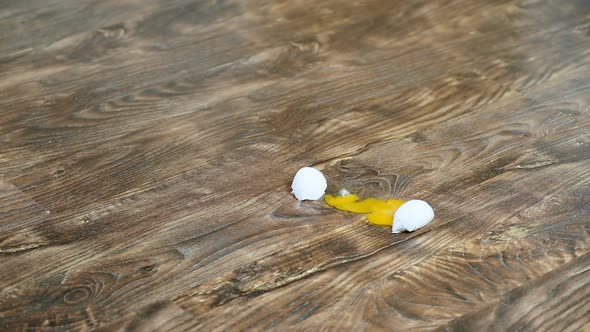 Falling and Breaking an Egg on Laminate