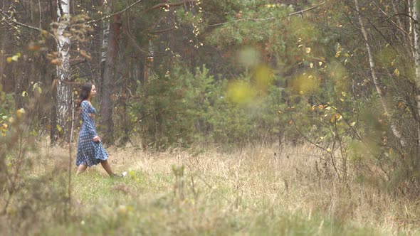 Girl Walks in Forest