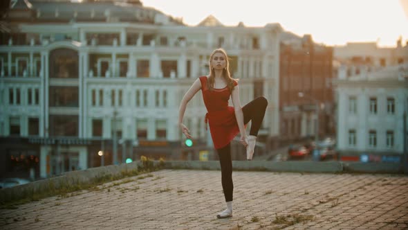 Young Woman Ballerina Training on the Roof alt