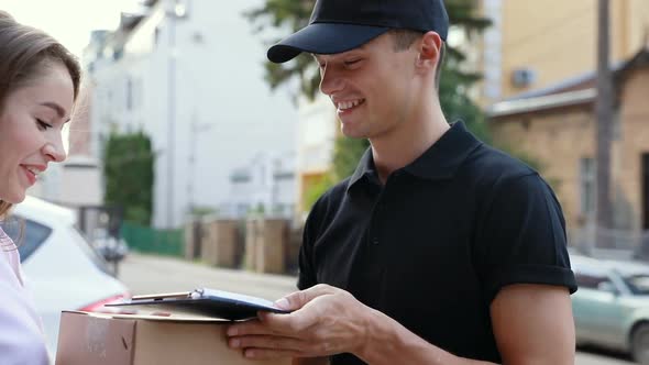 Delivery. Express Courier Delivering Package To Client Home alt