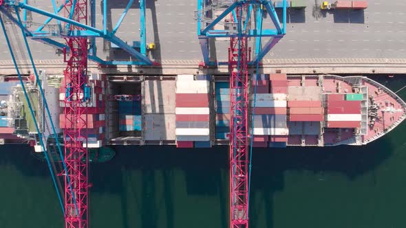 Drone Flying Over a Container Ship During Cargo Operations Over the Customs Area alt