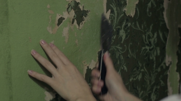 Woman Hands Removing Wallpaper