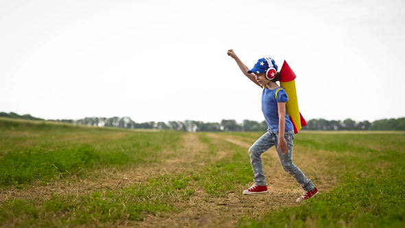 Happy Kid Playing In Summer Field