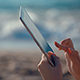 Woman With Tablet Pc By Sea On Windy Day - VideoHive Item for Sale