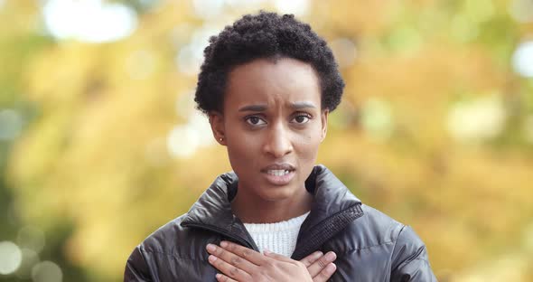 Sad Dark Skinned Black Woman Looks with Pleading Expression Asks To Forgive Her for Making Mistake alt