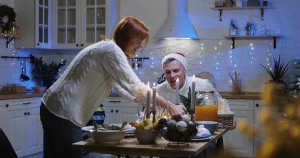 Family Around the Table at Christmas Dinner alt