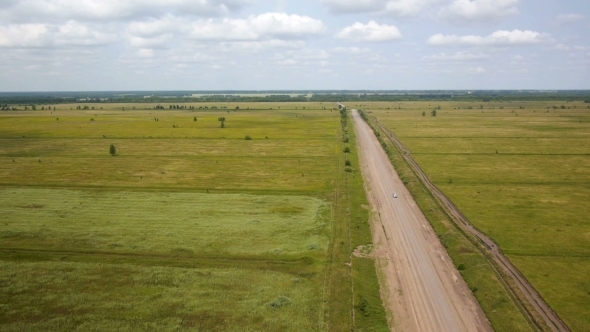 Aerial Shot Of Car On The Rural Road alt