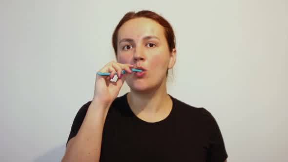 Woman Cleaning Teeth