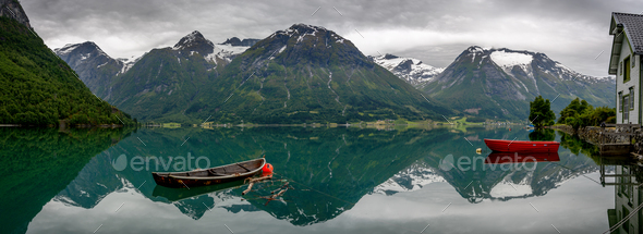 Panorama of the mountain reflection at Hjelle - Stock Photo - Images