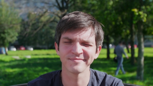 Positive Young Man Smiling And Showing Thumbs Up alt