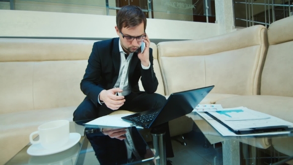 Businessman Immersed In Work alt