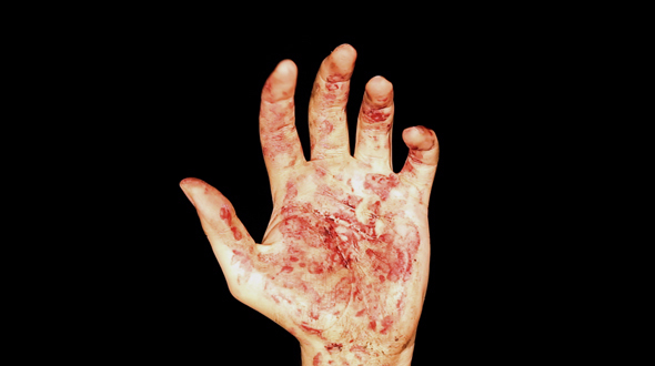 Male Bloody Hand Coming Up In The Darkness