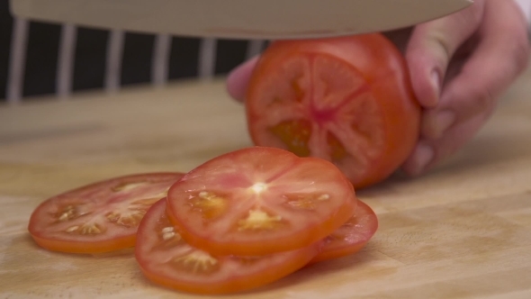Chef Cutting Tomatoes 