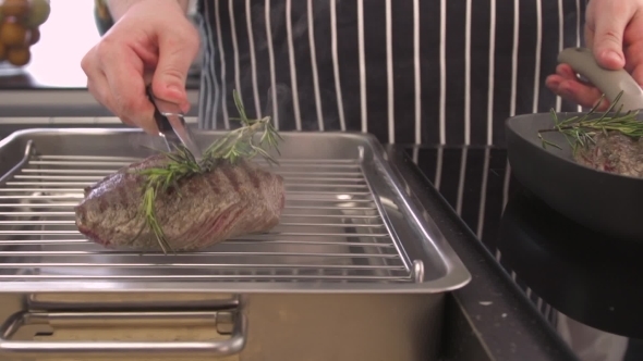 Chef Putting Pieces Of Steaks On Grill 