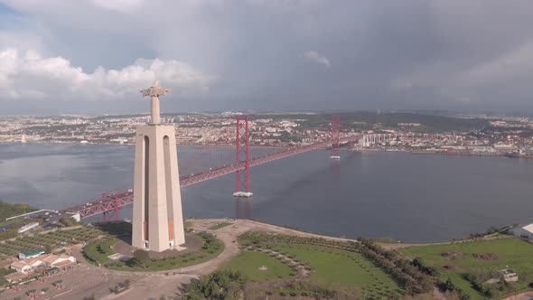 Aerial of Christ the King sanctuary and 25 de Abril Bridge
