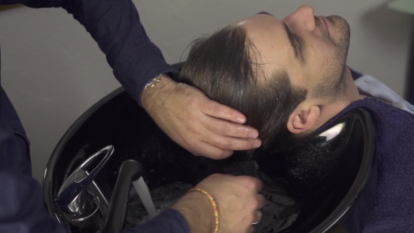 Man Washing Hair In Salon