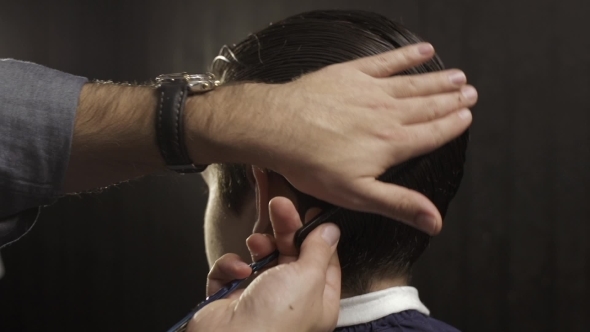 Hairdresser Combing Male Hair