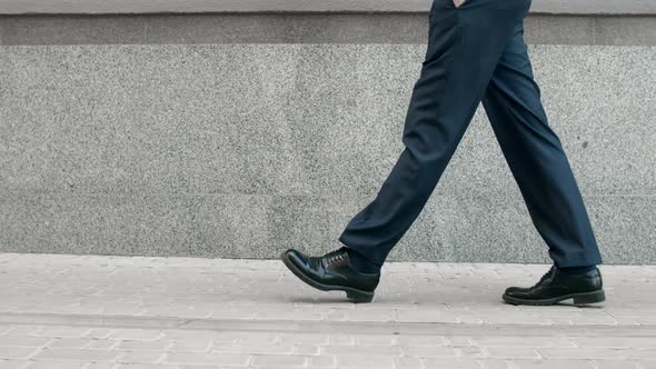 Cropped Image Man Walking in Black Shoes. Closeup Male Feet Going Near ...
