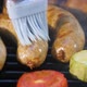 Lubricate Grilled Sausages with Oil with a Brush While Frying - VideoHive Item for Sale