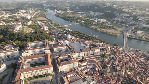 Aerial orbiting over university Buildings, Coimbra town near Mondego River alt