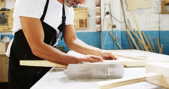 Carpenter working on his craft alt