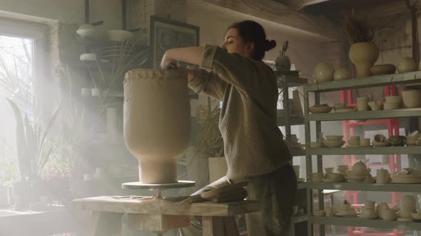 Woman Is Creating Vase In Art Studio alt