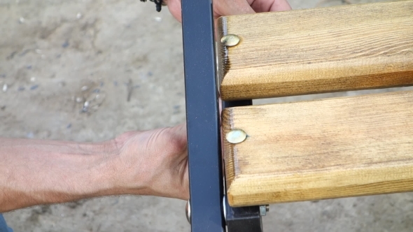 Men's Hands Tighten The Nut alt