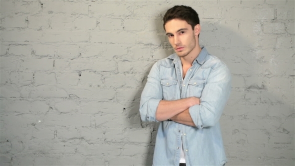 Male Posing In a Denim And a White T-shirt alt