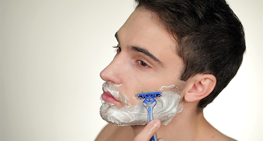 A handsome young man posing in the studio