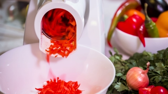 Carrots Being Grated In Special Device