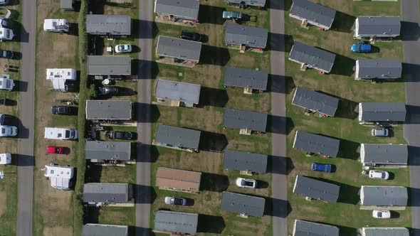 Top down aerial of a caravan holiday home park. Amazing shot of block organisation. Mobile towed car alt