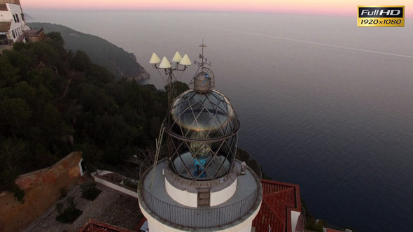 Lighthouse Aerial Shot View at Sunset alt