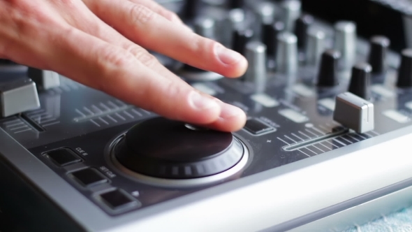 DJ Working With Sound Mixing Console. alt