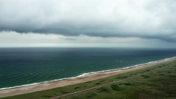Drone Flight Over Beach And Grassy Landscape Next To Sea Of Jutland alt