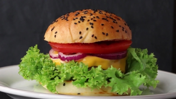 Rotating Ceramic Plate With Fresh Homemade Burger