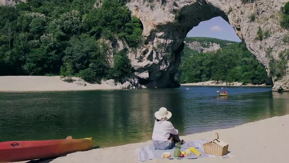 Couple on the Beach By the River in the Ardeche France Pont d Arc Ardeche Franceview of Narural Arch alt
