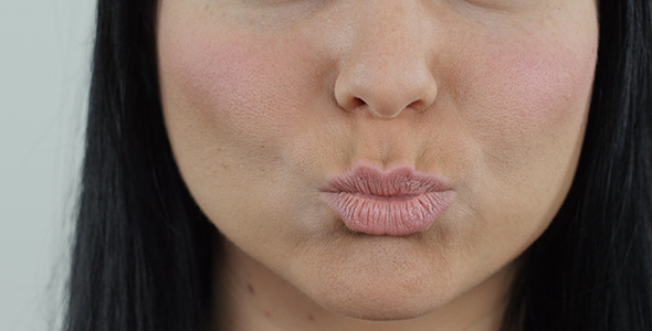 Woman Smiling and Kissing