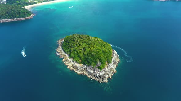 Nice rocks forested island, aerial panorama of Ko Pu against mountainous Phuket landscape on backgro alt
