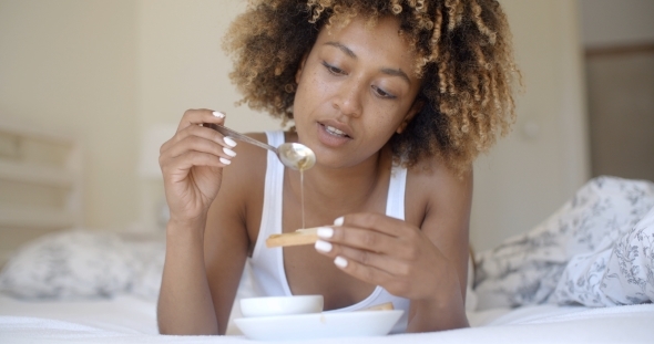 Woman Enjoying Breakfast In Bed alt
