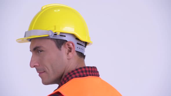 Rear View of Young Happy Hispanic Man Construction Worker Looking Back