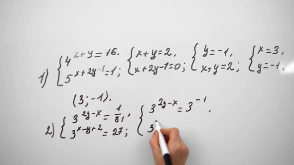 Young Male Student is Writing Equation on Whiteboard