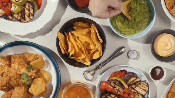 A table filled with various dishes and sauces