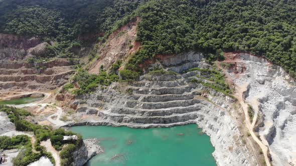 Aerial view of opencast mining quarry with big pool. Aerial view from drone shoot alt