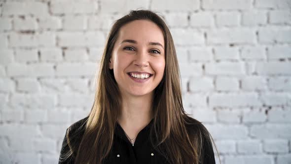 Girl Raises His Head Opens Beautiful Green Eyes and Smile alt