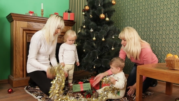 Two Happy Mothers With Babies Playing 