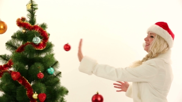 Happy Young Lady Playing With Decorations In